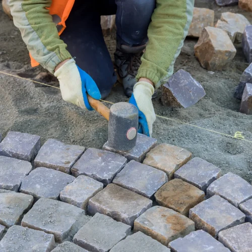 the-worker-were-using-industrial-cobblestones-to-p-2026-01-09-08-29-02-utc